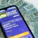 Mais 2,4 milhões têm saque da 1ª parcela do auxílio liberado hoje, confira calendário